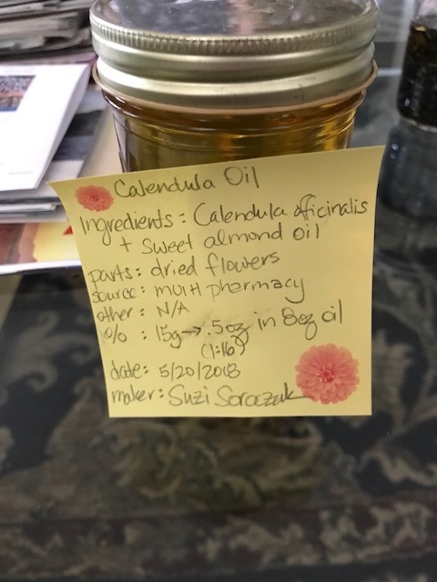 medicine making infused calendula oil